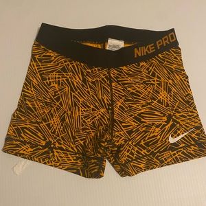 Orange and black Nike Pro spandex shorts